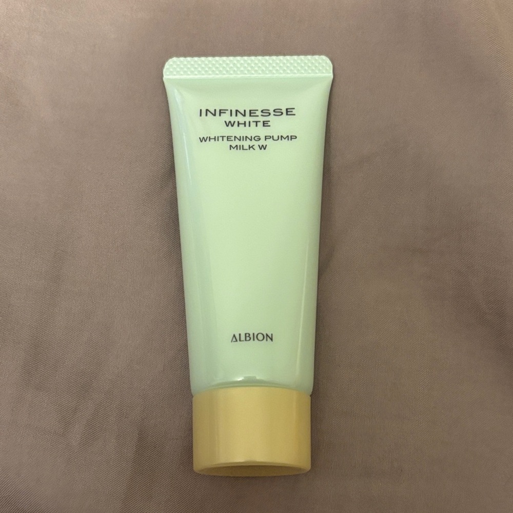 Albion Infinisse White Whitening Milk with Cream and Gold Accents